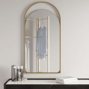 Дизайнерское арочное настенное зеркало Arkelo S в металлической раме золотого цвета.