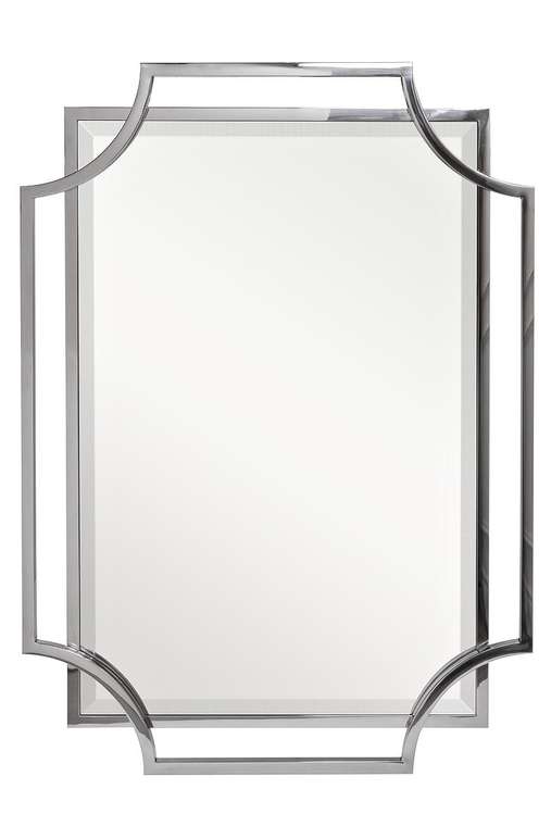Настенное зеркало в металлической раме
