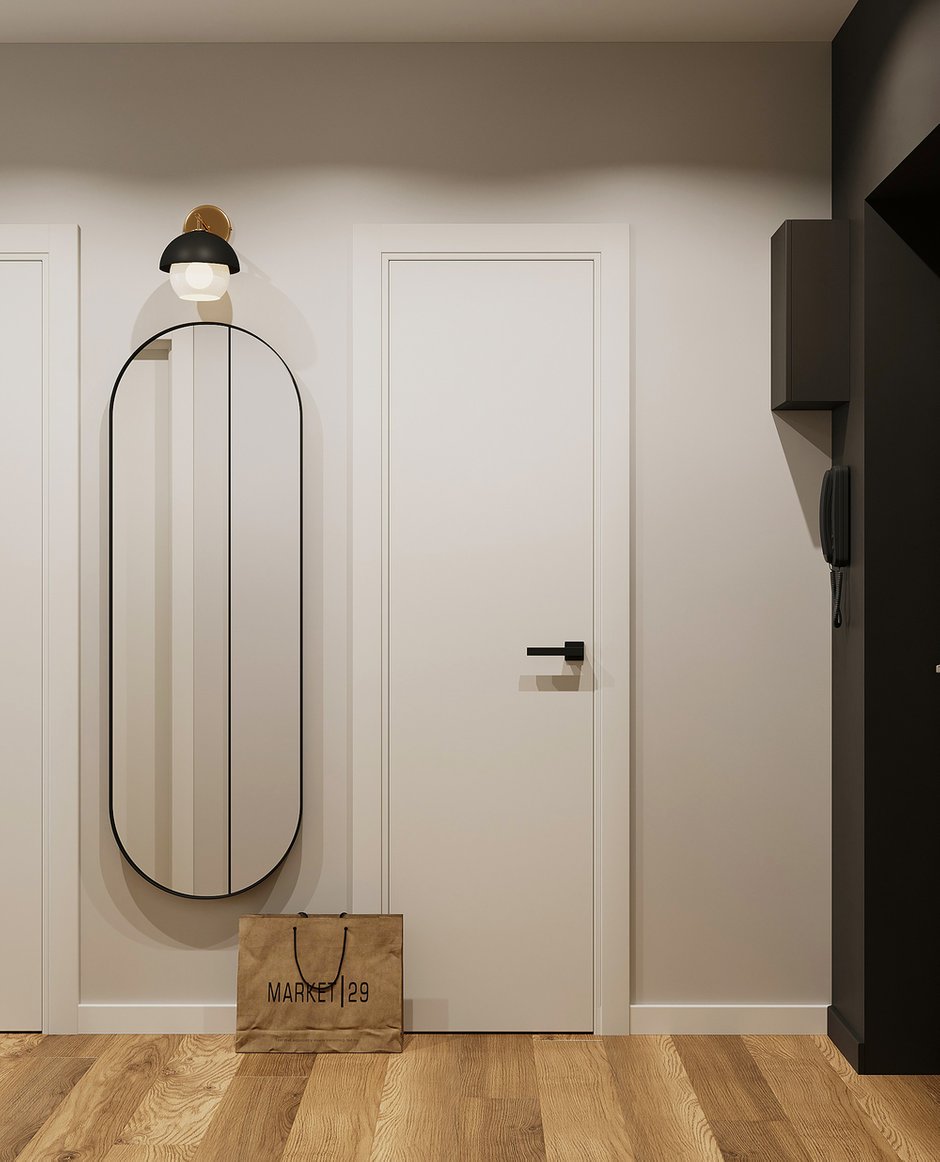 От плитки в зоне входной двери решили отказаться, чтобы сохранить визуальную целостность напольного покрытия.