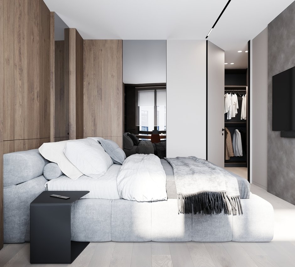 В спальне есть своя ванная комната и гардеробная, что очень удобно. Скрытые двери также позволяют сохранить ощущение единства отделки.