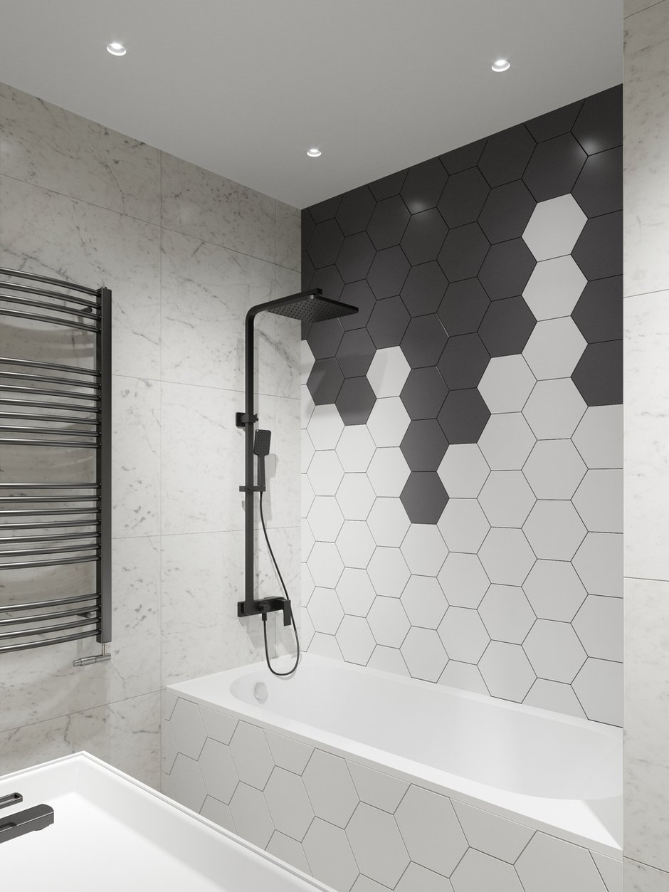 В санузле разместилась полноценная ванна 170 см. При входе находятся стиральная машина и шкаф над ней для грязного белья и бытовой химии, произведенный на заказ по эскизам дизайнеров.