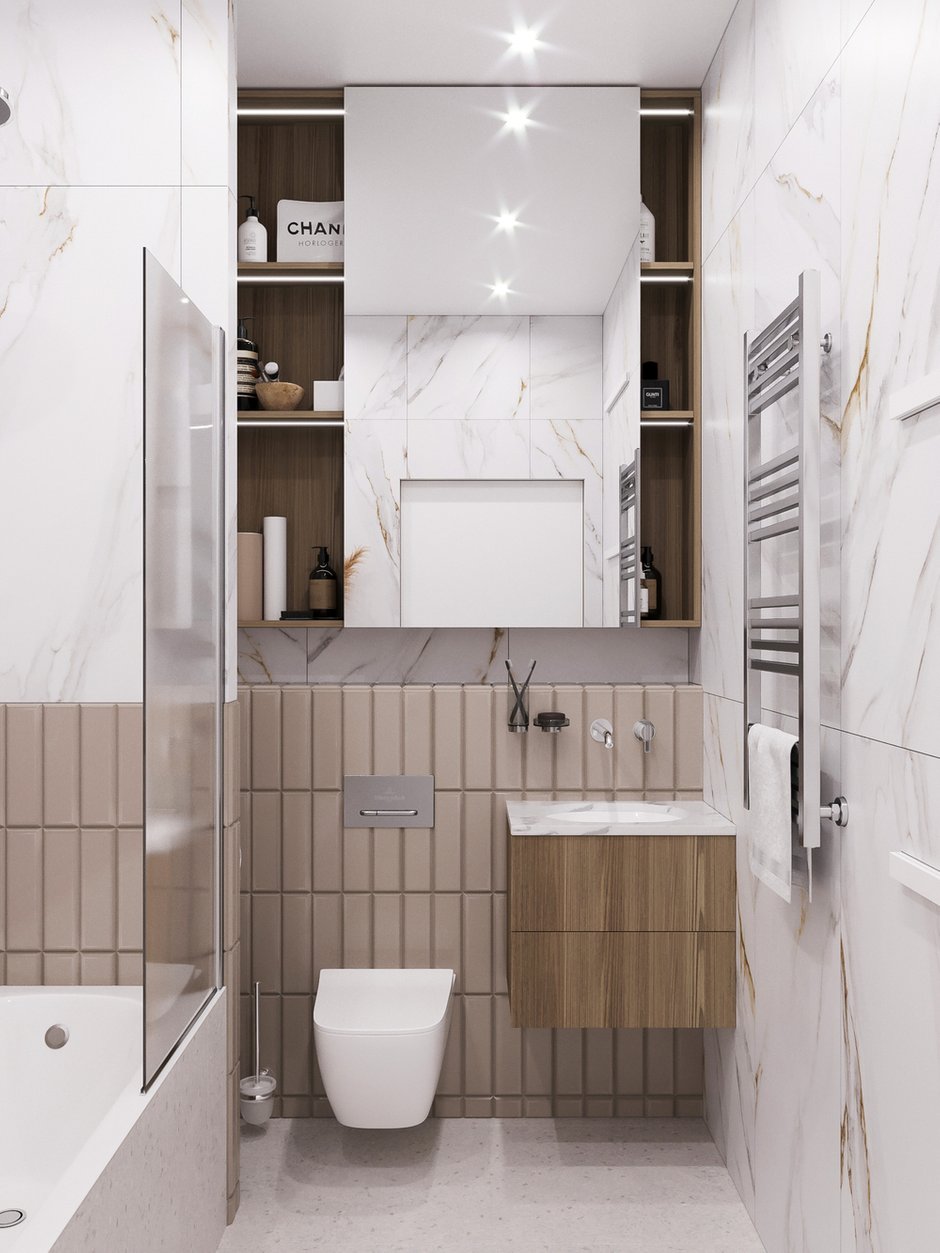 Оба санузла довольно компактные, поэтому важно было грамотно использовать пространство. Так как проектом предусмотрена кладовая с местом для уборки, в санузлах было решено отказаться от хозяйственного шкафа и ограничиться местом для средств гигиены.